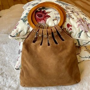 Stylish and fun suede leather handbag.